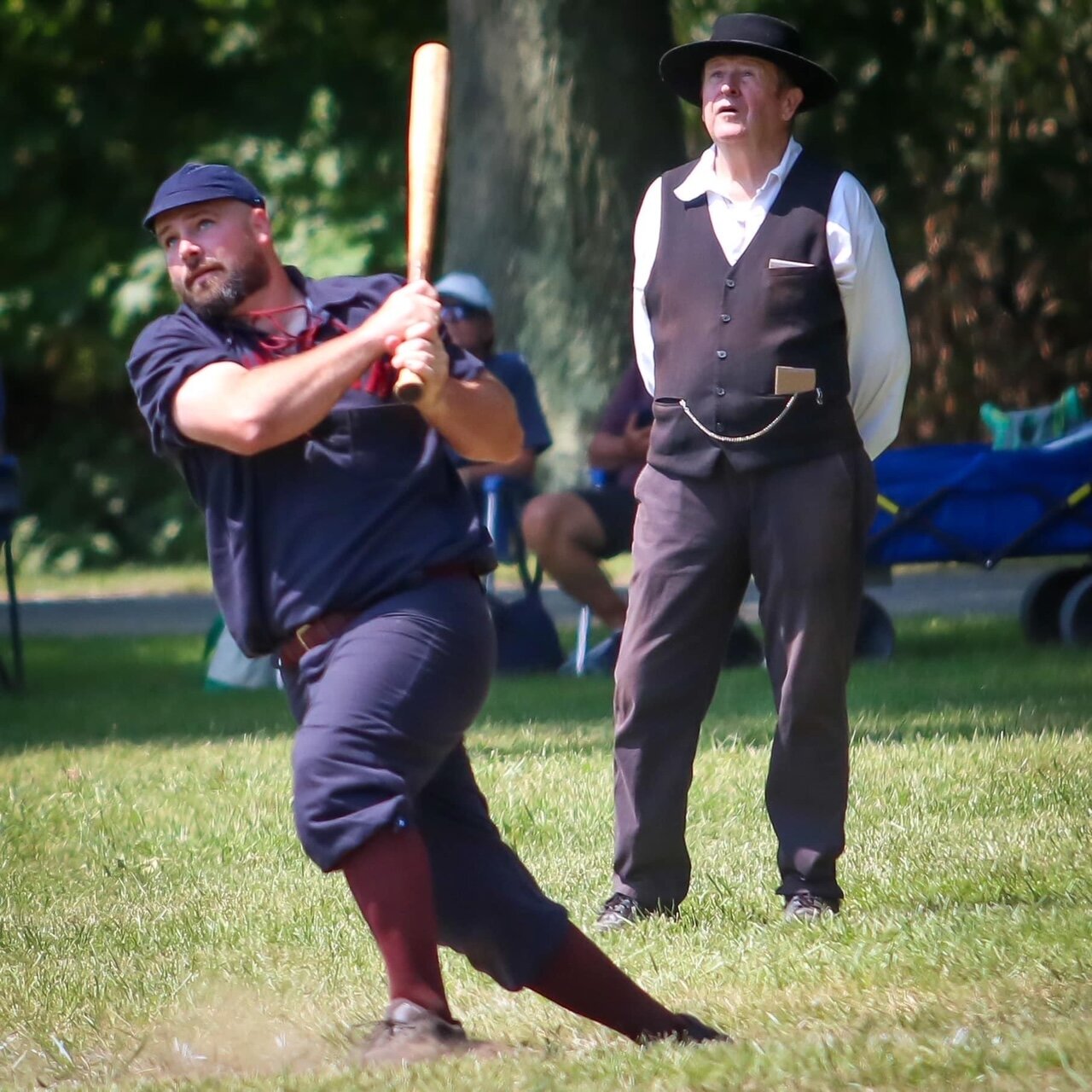 Devon “Beeds” Bedient swats the sphere into deep left field as the arbiter looks on in an 1860 rules match at the Doc Adams Old Time Base Ball Festival in Bethpage.